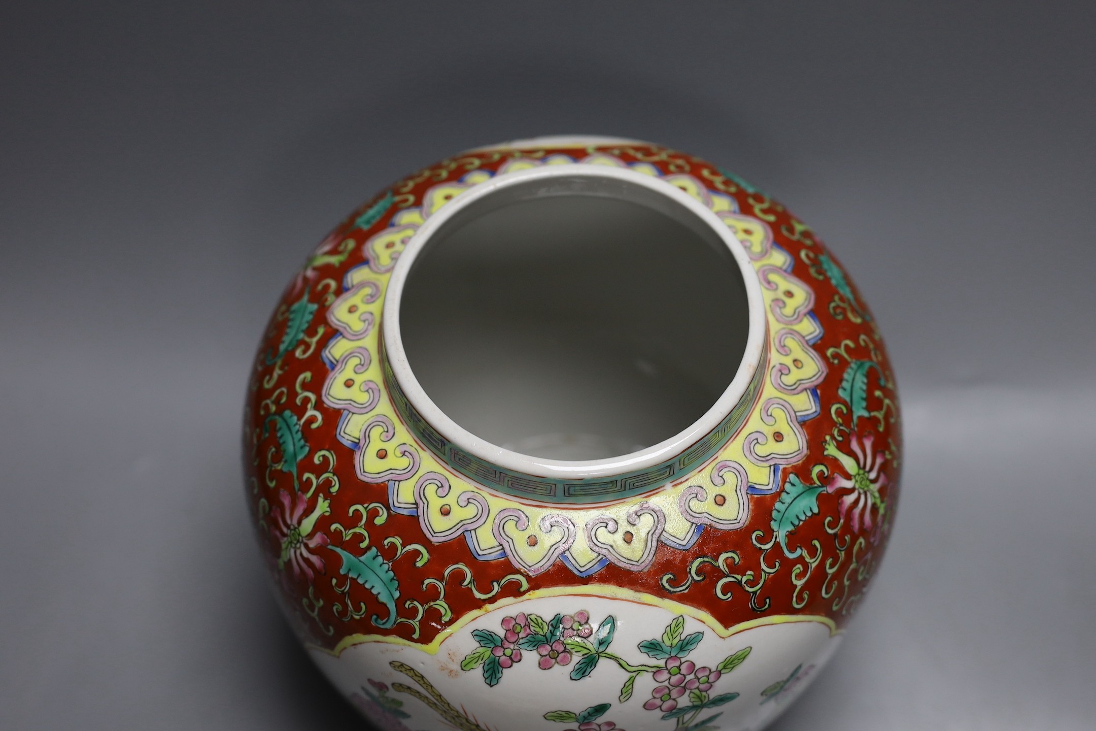 A Chinese coral ground jar and cover, 23cm